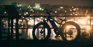 Toronto at night with a bicycle in the foreground