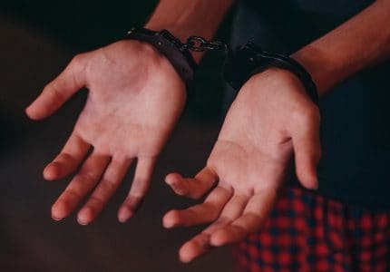 Sexual Assault Charge - Handcuffed open palms